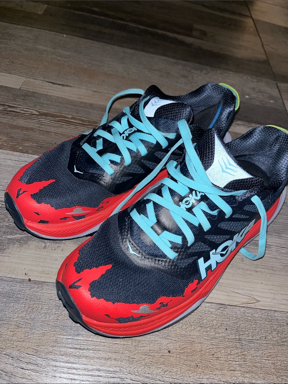 Hoka Women’s Navy with Red Flame Accents and Light Blue Laces